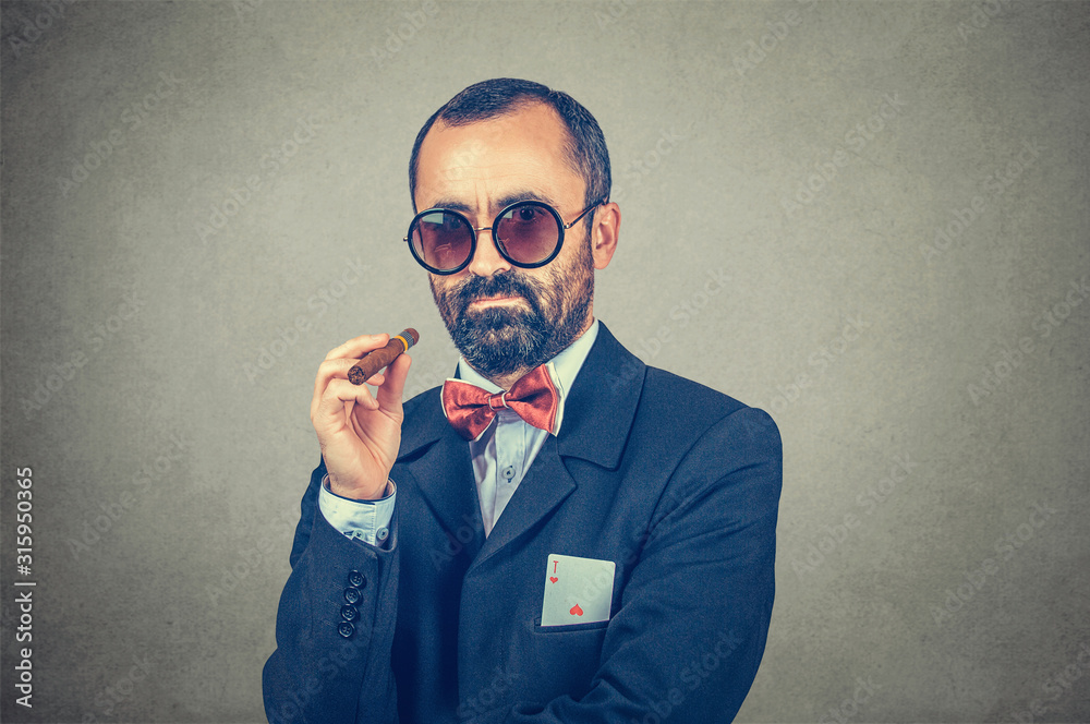 man in sunglasses, holding a cigar in hand with an ace in his pocket man in sunglasses, holding a cigar in hand with an ace in his pocket