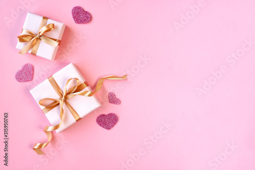 Gift boxes with heart on pink background.  Valentine, mother, woman greeting card . Flat lay. Top view with space for text   © Veliavik
