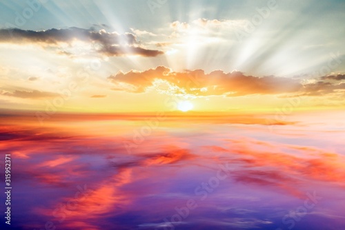 Fototapeta Naklejka Na Ścianę i Meble -   Beautiful sunrise .   Beautiful heavenly landscape with the sun in the clouds  .