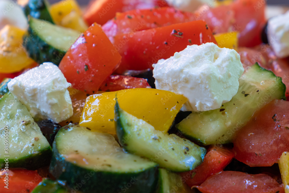 Greek salad with tomatoes and cucumbers close up Greek salad with tomatoes and cucumbers close up