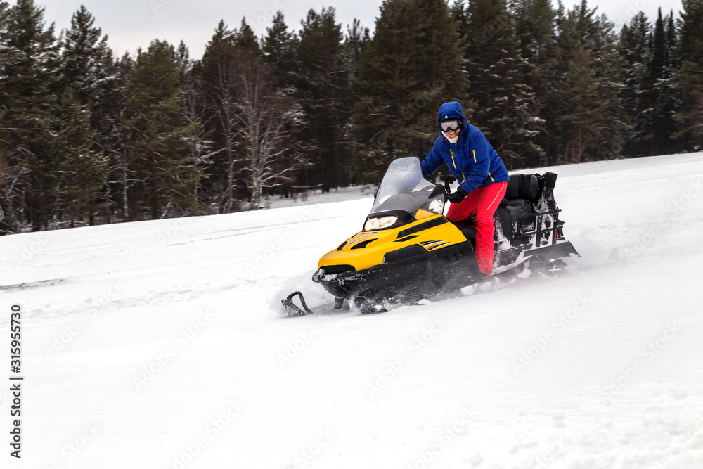 Athlete on a snowmobile. Athlete on a snowmobile.