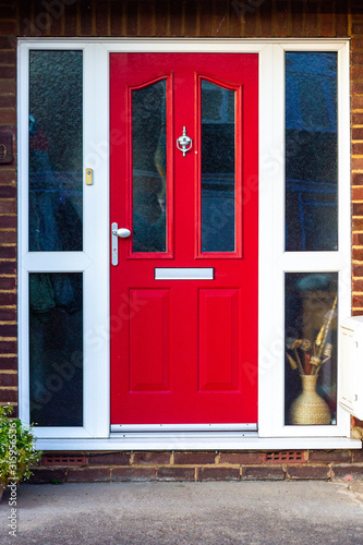 Vibrant and dynamic red wooden front door