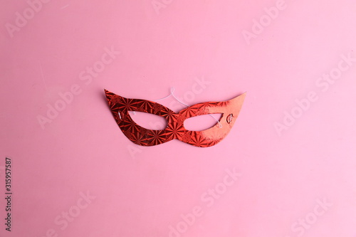Party cardboard mask on colorful background © robcartorres