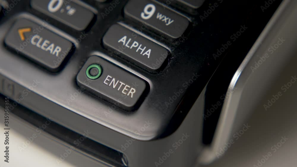 credit card in a black crocodile case is attached to a black terminal credit card in a black crocodile case is attached to a black terminal