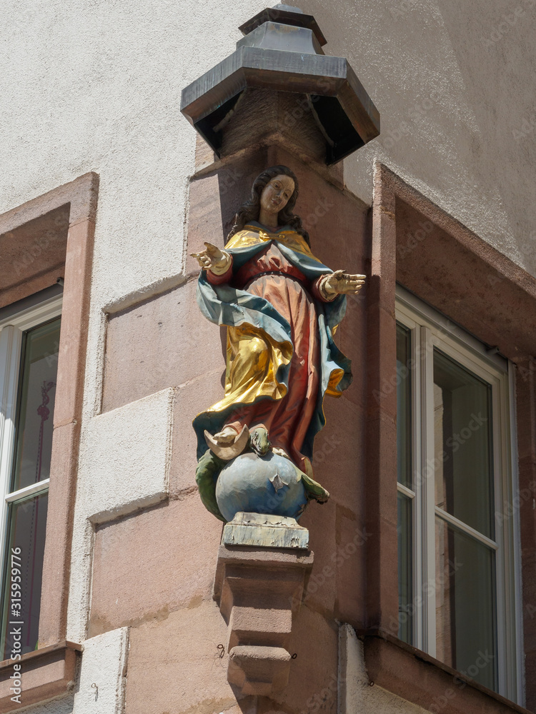 Sculpture on the facade of a house in Nuremberg, Bavaria, Germany