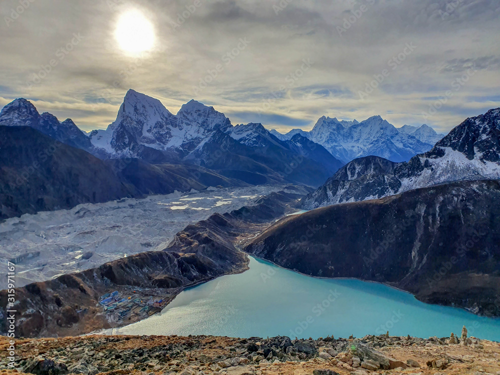 Obraz premium Picturesque Cholatse mountain and Dudh Pokhari lake view from Gokyo Ri at sunrise. Trekking in Solokhumbu, Nepal, Himalayas.