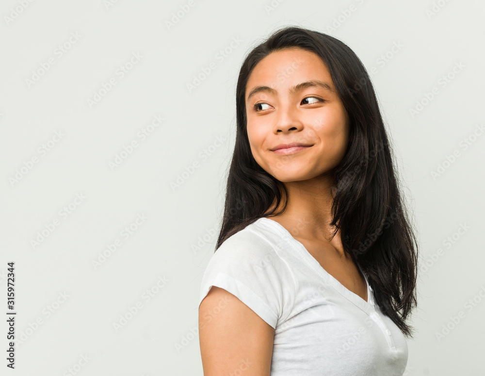 Young chinese woman posing on a white background Young chinese woman posing on a white background