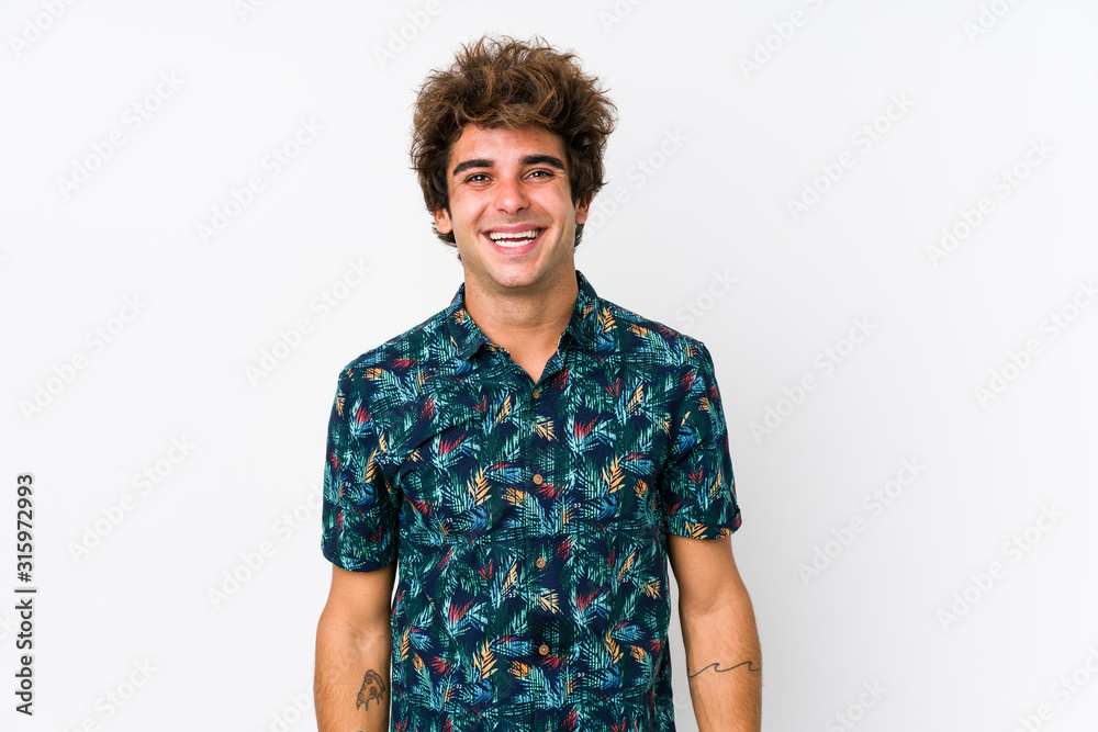 Young caucasian man wearing a flower t-shirt isolated happy, smiling and cheerful. Young caucasian man wearing a flower t-shirt isolated happy, smiling and cheerful.