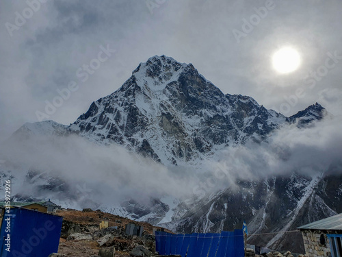 Lodge in Dzongla and Cholatse mountain. Everest base camp trek: from Dragnag to Dzongla via Cho La pass. Trekking in Solokhumbu, Nepal. photo