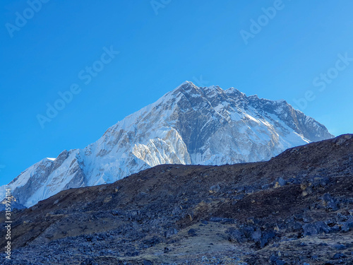 Early morning view on Nuptse. Everest base camp trek: from Lobuche to Gorak Shep, Nepal, Himalayas.