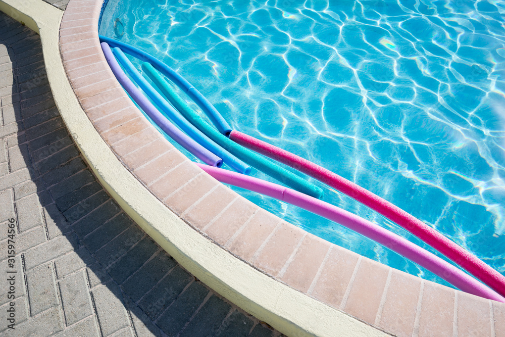 Floating tubes in a swimming pool Stock Photo Adobe Stock
