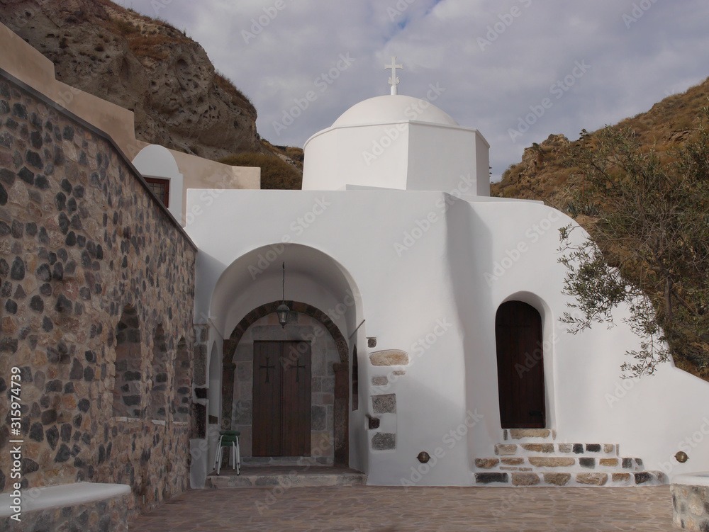 Fototapeta premium Temples and monasteries of the historical part of the Emporio, the largest village of Santorini,Greece.