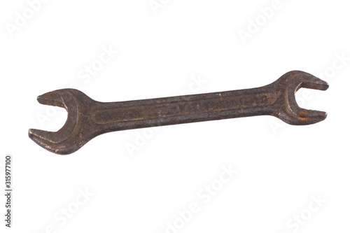 Old rusty wrench isolated on a white background.