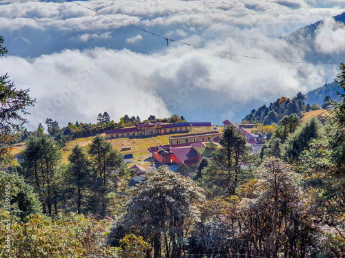 At the top of Taksindu La pass. Beautiful above-clouds view. Everest base camp trek: way from Kharikhola to Taksindu. Himalayas, Solokhumbu, Nepal.