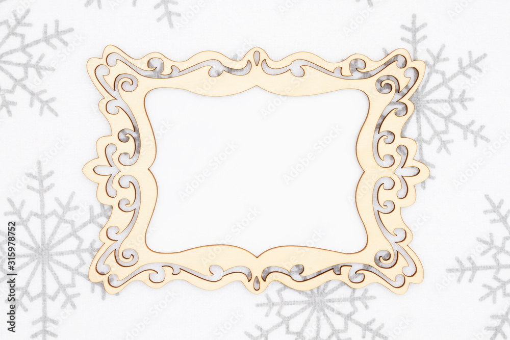Blank wood frame with white and gray snowflake background