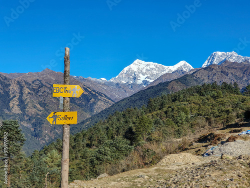 A trekking sign at the top of Taksindu La pass. Everest base camp trek: from Taksindu to Salleri. Himalayas, Nepal - November 2019