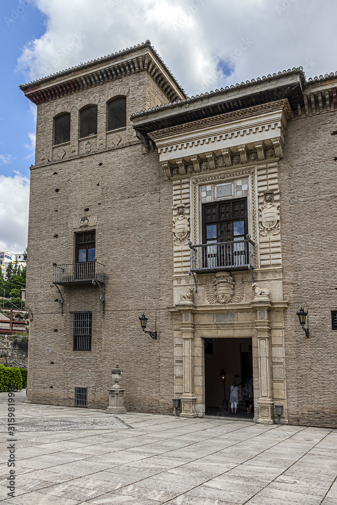 View of Palacio de los Cordova (now Historical Archive). Palace of Cordova was built at Placeta de las Descalzas around 1530 - 1592. Palace surrounded by beautiful gardens. Granada, Andalusia, Spain.