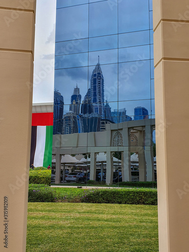 DUBAI, UAE - NOVEMBER 2019: Tecom distric with its fantastic skyscrapers, green parks and cozy cafes.