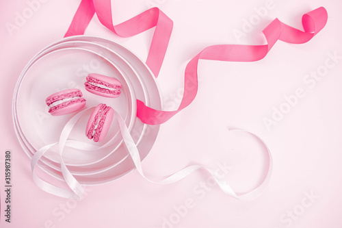 Valentine`s Day. Pink background with macaroons. Soft pastel love. Flat lay, top view. Valentines Day 2021. Romantic wallpaper. Stories background template. Banner lovers day sale. Wedding invitation