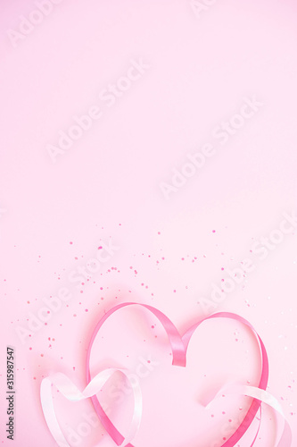 Ribbon hearts. Soft pastel background to Valentine`s Day 2023. Light pink sparkles. Flat lay. Romantic mobile wallpaper. Stories background template. Banner lovers day sale. Wedding invitation photo