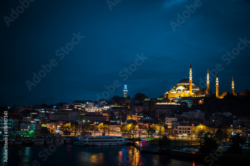 Suleymaniye Mosque view from Golden Horn during twilight with amazing lights and colors