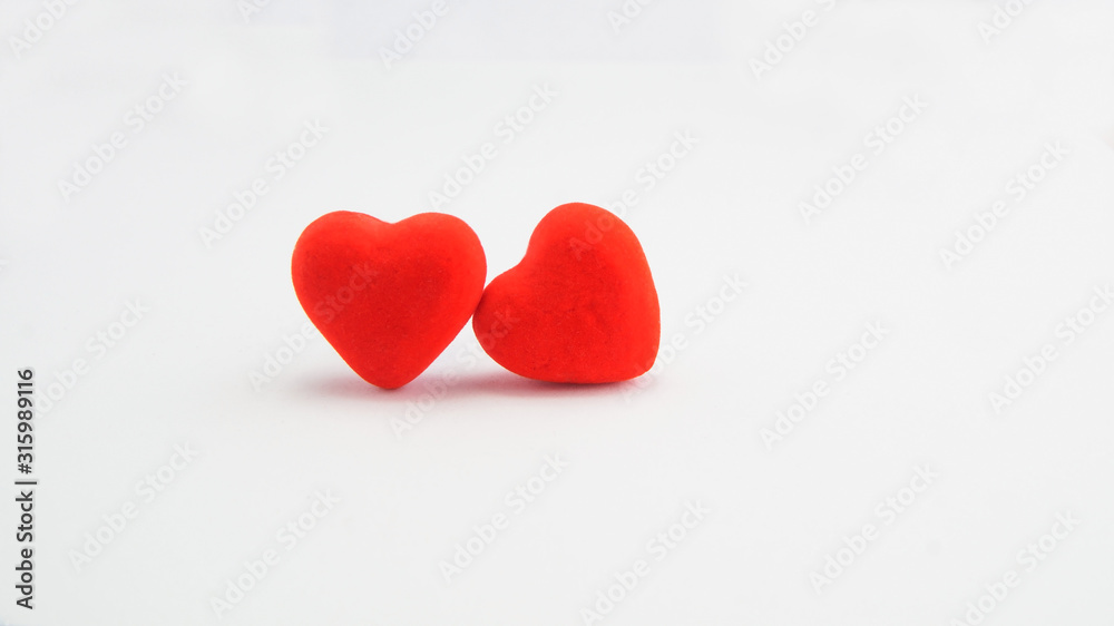 two red hearts on a white background