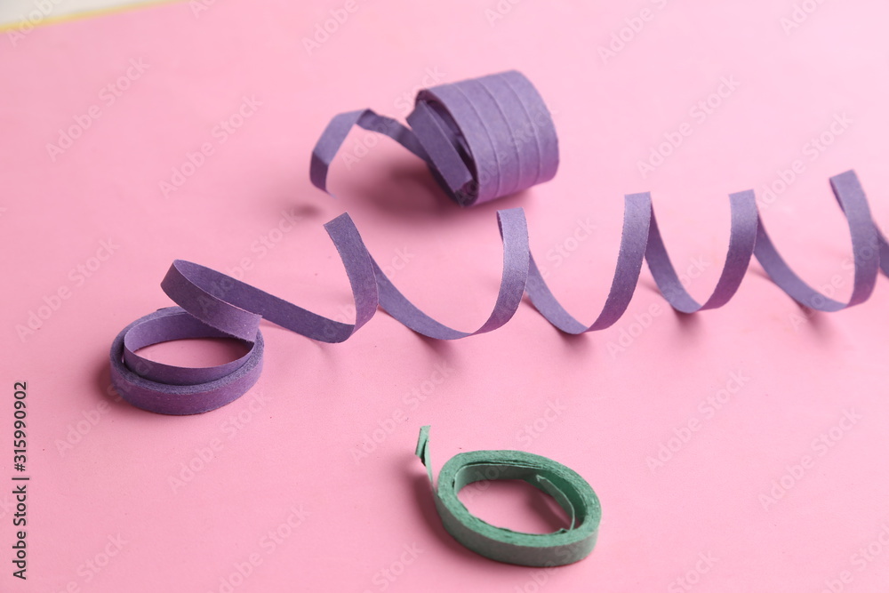 party streamers on colorful background party streamers on colorful background