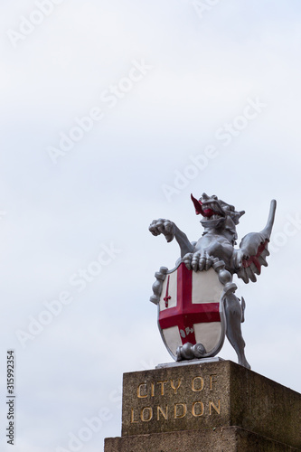 City of London dragon on pedestal isolated on white background