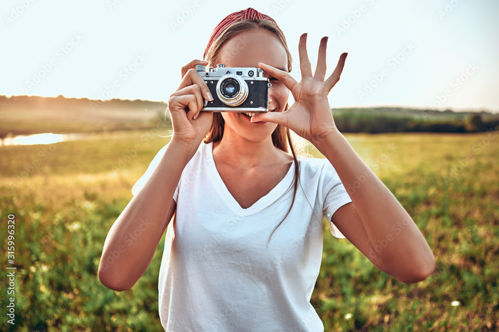 Outdoor summer lifestyle portrait of pretty young woman having fun on the nature Outdoor summer lifestyle portrait of pretty young woman having fun on the nature