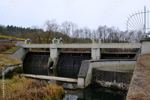 Wallpaper Mural Dam at Lapino Hydroelectric Power Station on the Radunia River and flowing swan. Lapino, Kaszuby, Poland Torontodigital.ca