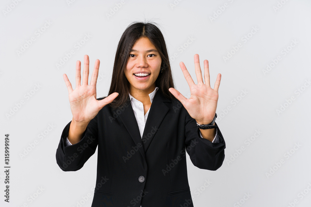 Young asian business woman showing number ten with hands. Young asian business woman showing number ten with hands.