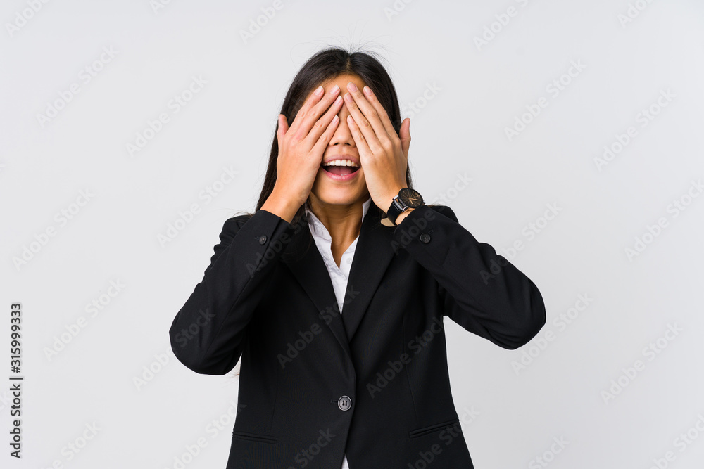 Young asian business woman covers eyes with hands, smiles broadly waiting for a surprise. Young asian business woman covers eyes with hands, smiles broadly waiting for a surprise.