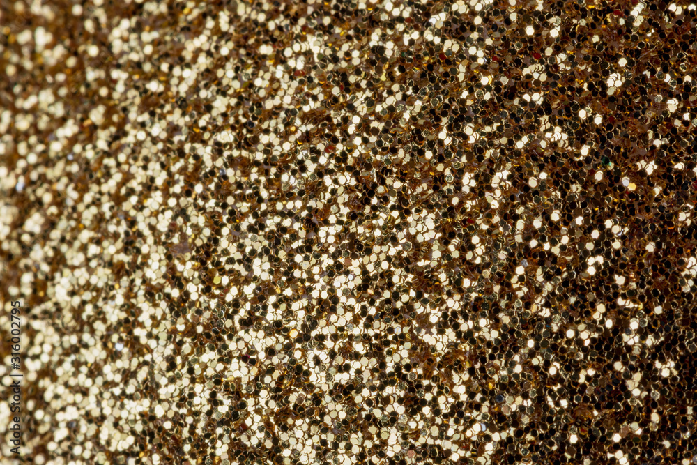 Gray shiny background from many small sparkles. Close-up, golden background for sites and layouts. Gray shiny background from many small sparkles. Close-up, golden background for sites and layouts.