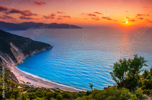 Fototapeta Naklejka Na Ścianę i Meble -  Beautiful summer sunset on Mirtos beach in Greece