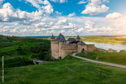 Old fortress by the river in Khotyn, Ukraine photo