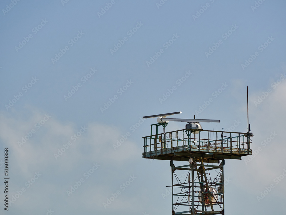 Tower with antennas and repeaters against the sky