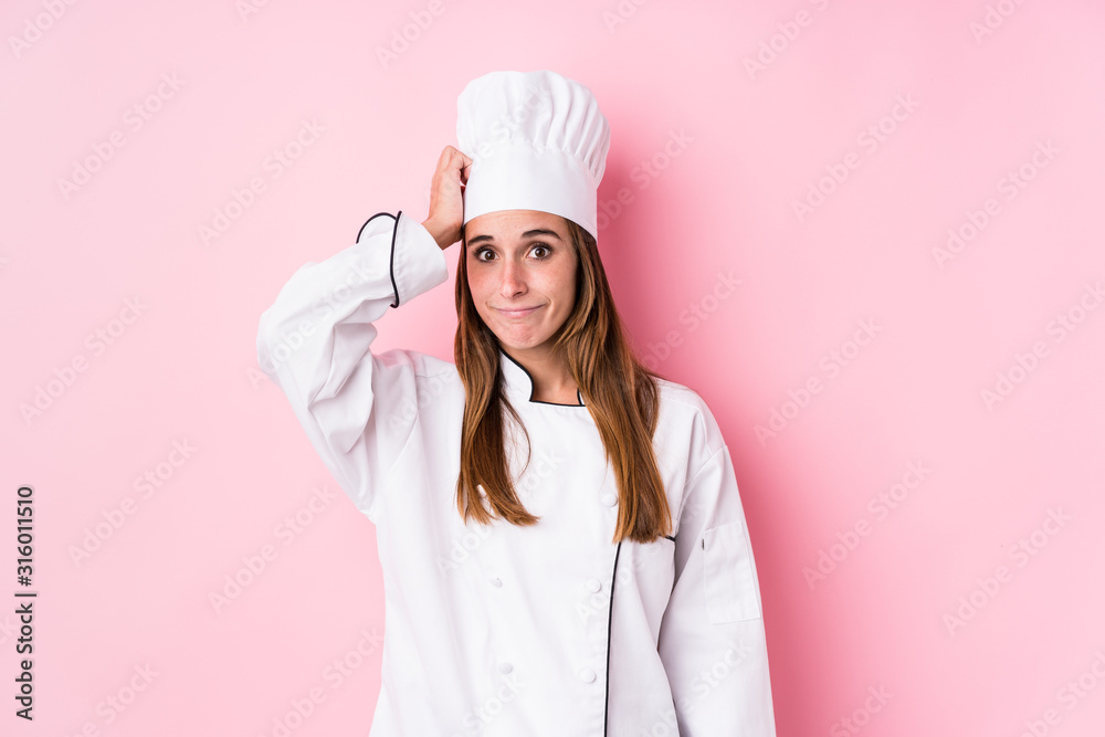 Young caucasian chef woman isolated being shocked, she has remembered important meeting. Young caucasian chef woman isolated being shocked, she has remembered important meeting.