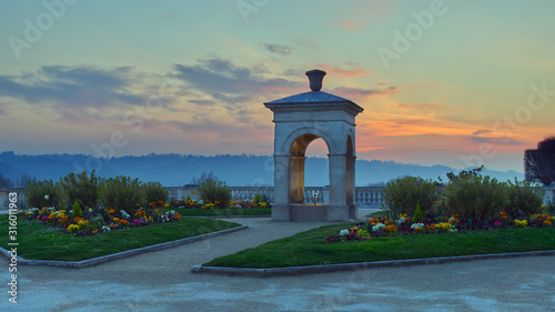 Sunset on the fountain Alfred de Vigny, Boulevard des Pyrénées in Pau, France.