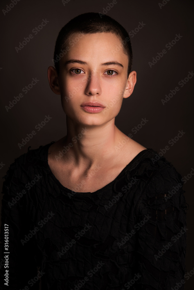 portrait of young woman, fashion beautiful model, brunette girl with short hair in studio, close up, young bold  woman head shot 