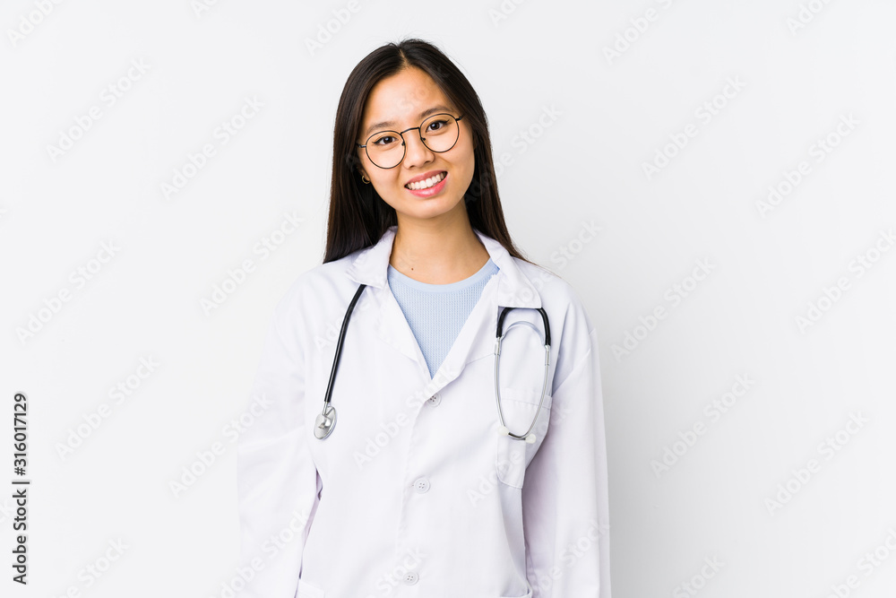 Young doctor chinese woman isolated happy, smiling and cheerful. Young doctor chinese woman isolated happy, smiling and cheerful.