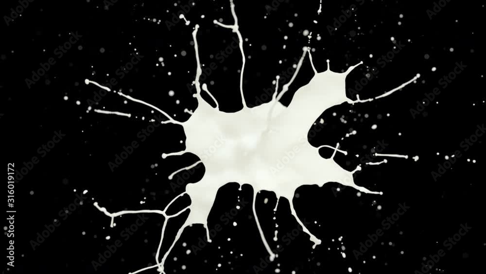Cg animation of milk explosion on black. Slow motion. Has alpha matte