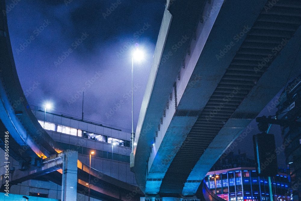 Highway overpass through downtown Tokyo at night Highway overpass through downtown Tokyo at night