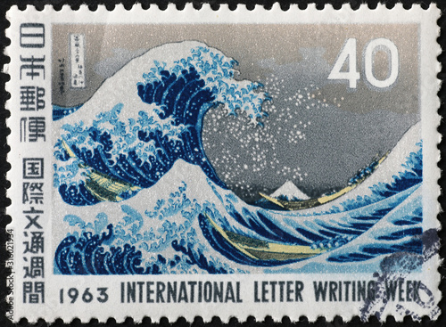 Famous great Wave off Kanagawa on japanese stamp photo