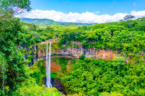 Chamarel Waterfall in lush tropical greenery of Mauritius, Indian Ocean