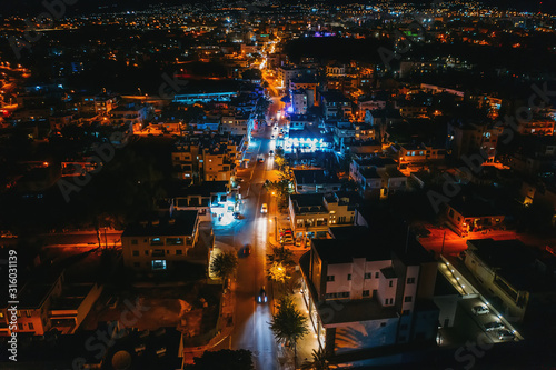 Top Down Aerial view of road at night city with cars driving, drone shot. © DedMityay