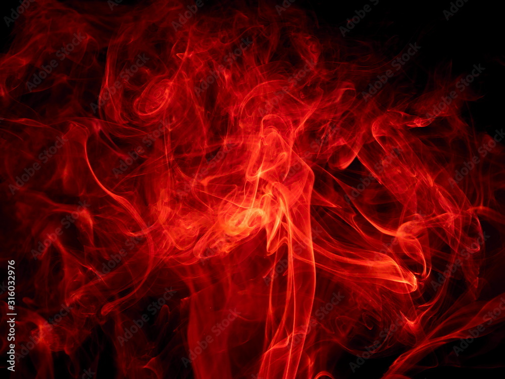 Red smoke on black background