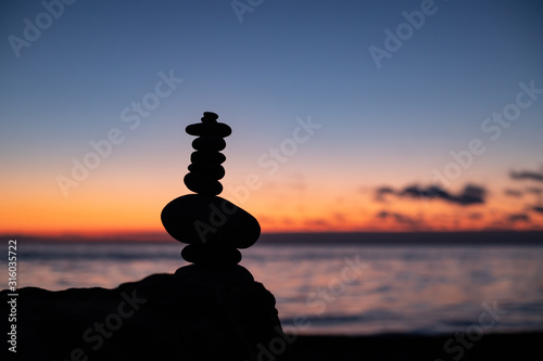 Zen concept. Sunset. The object of the stones on the beach at sunset. Relax & Meditation. Zen stones.