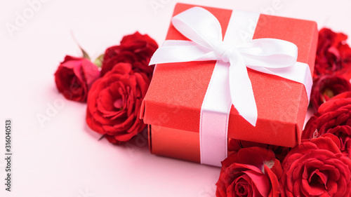 Red gift box and red roses flowers for giving in special day