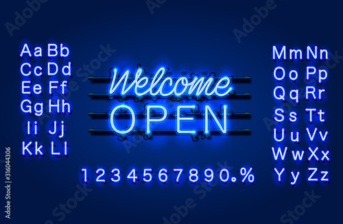 Neon welcome open signboard on the brick wall background.