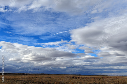 Dramatic looking sky and clouds with mountain background in high desert  near Arizona Utah border